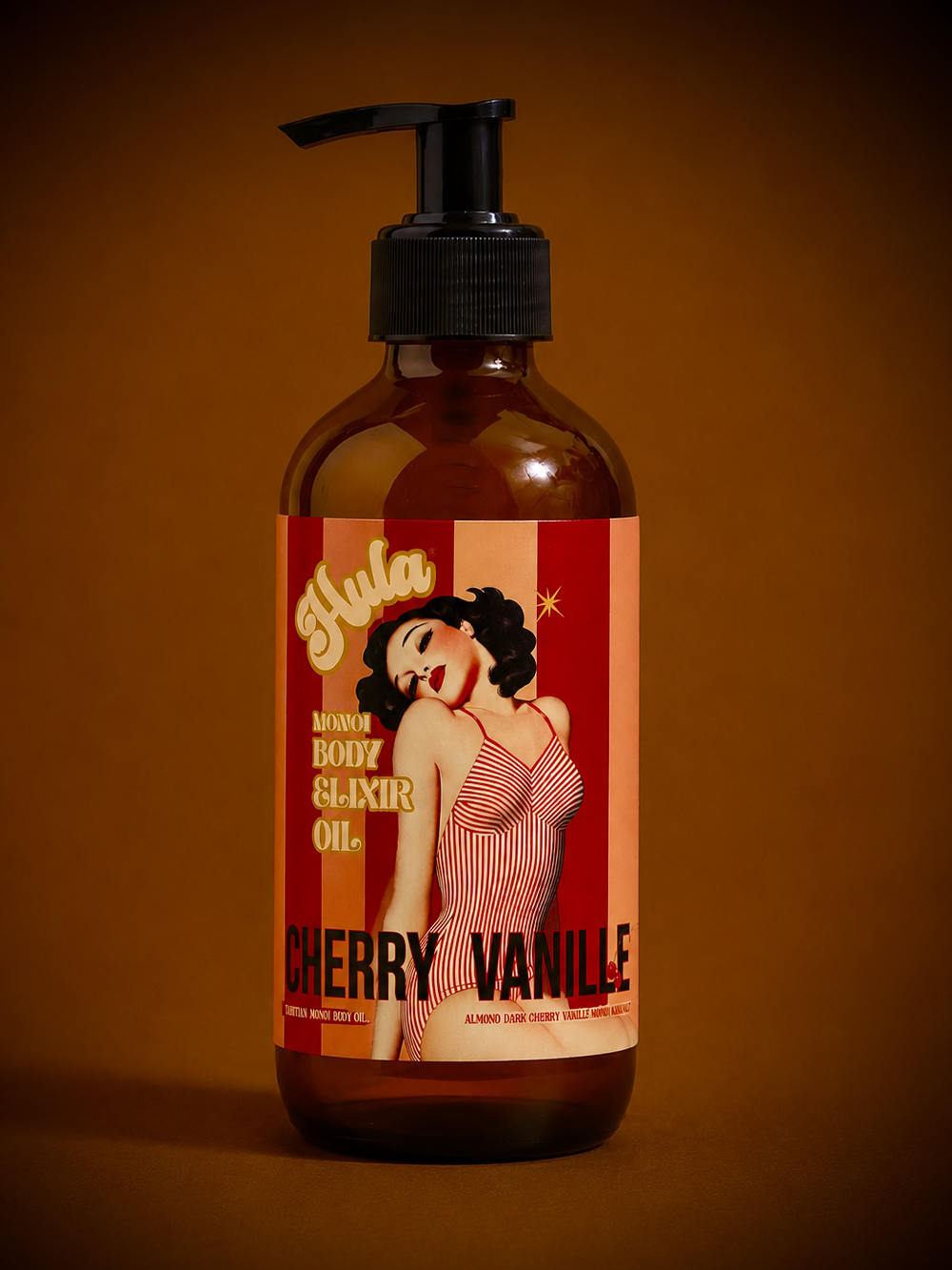 An amber glass pump bottle of Hula Cherries Jubilee body oil, featuring a retro pin-up woman label, set against a dark brown background.
