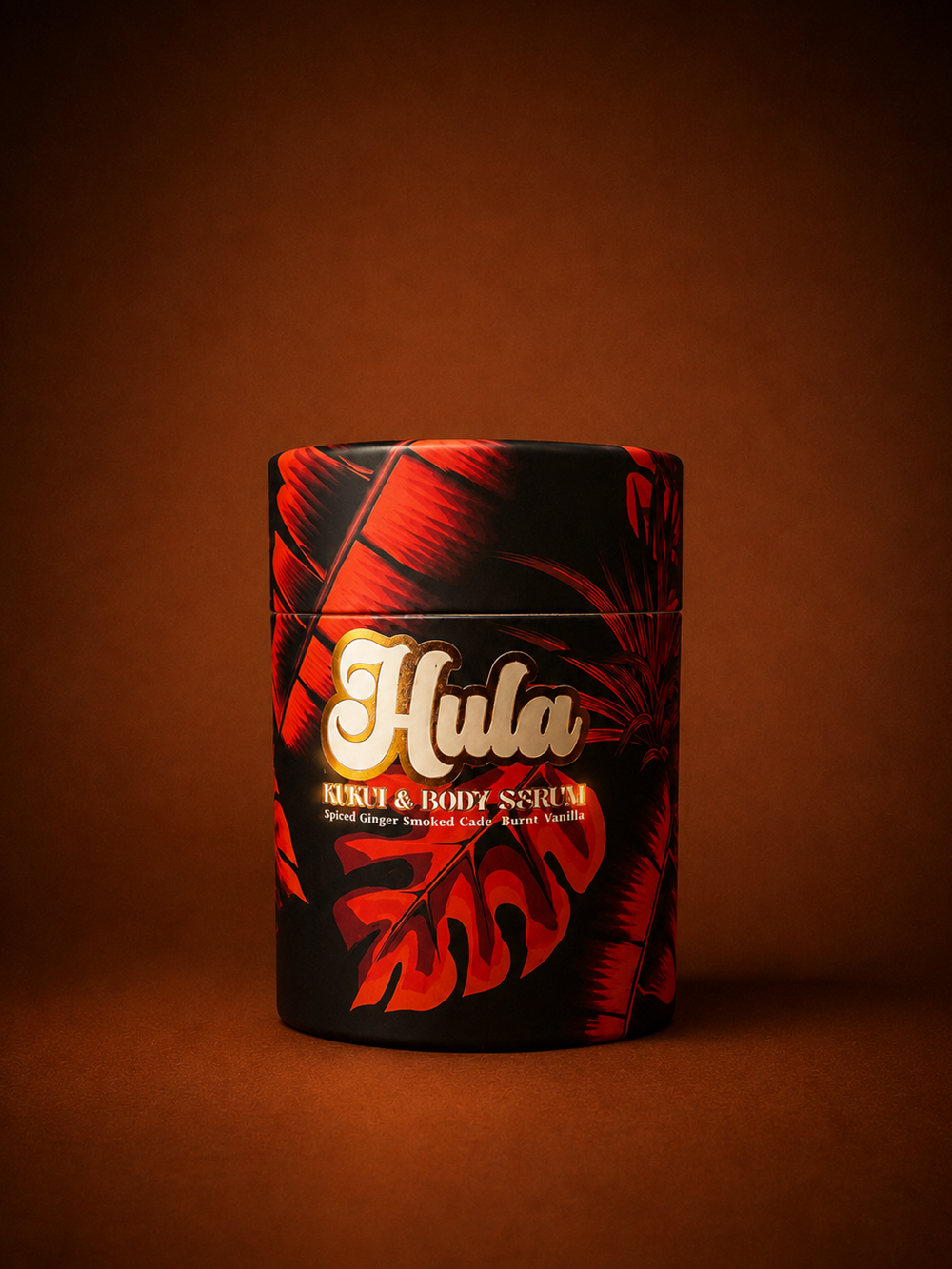 A cylindrical tin of Hula Kukui & Body Serum with a black and red tropical leaf pattern, set against a warm brown gradient background.