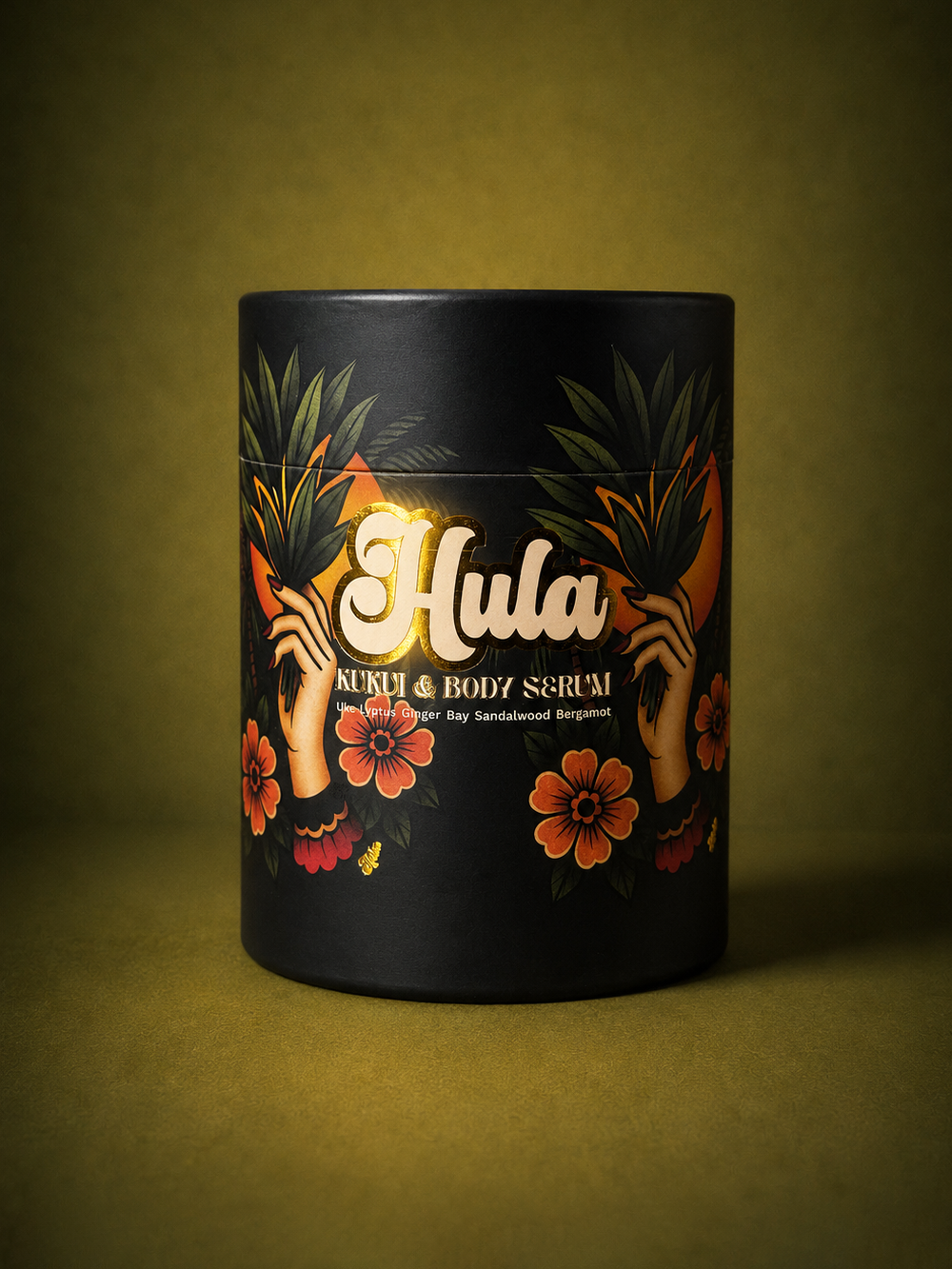 A black cylindrical tin of Hula Kukui & Body Serum, decorated with tropical floral illustrations and gold lettering, set against a dark olive green background.